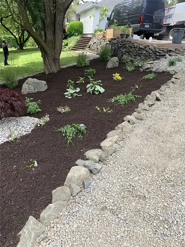Some neat and professional mulching work done by Santiago Lawn Maintenance